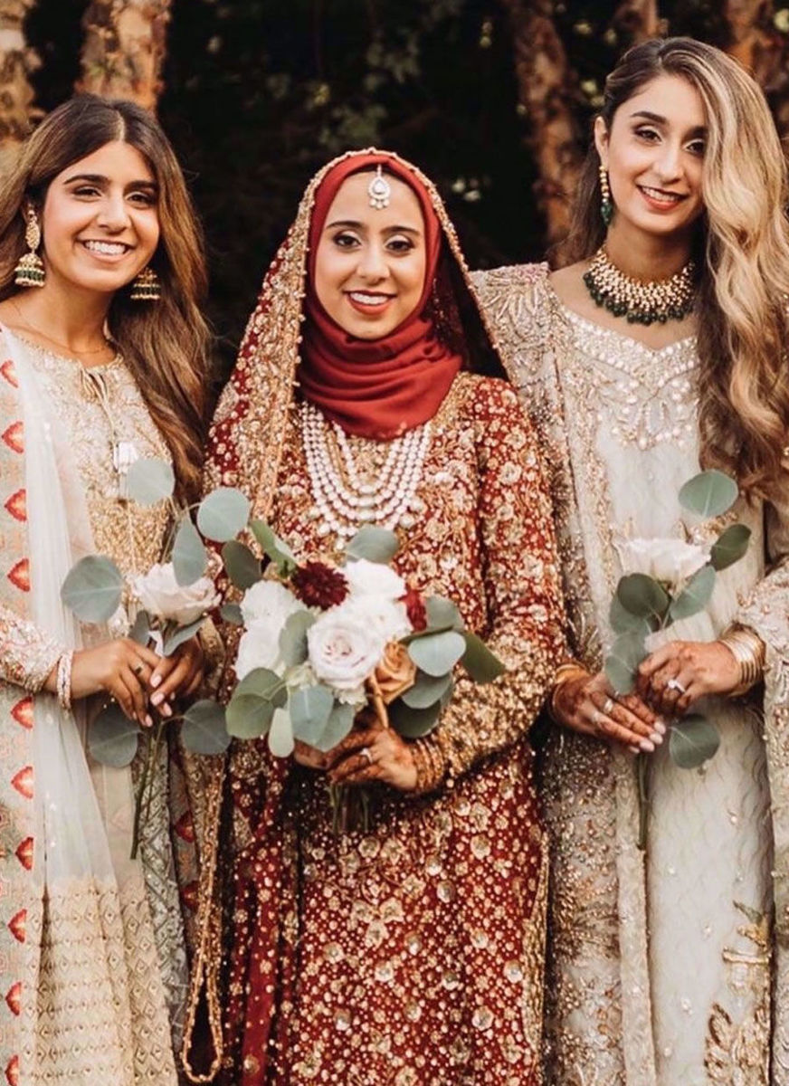 Marriyah Simjee In Shades Of Reds With Intricate Embellishments In Golds