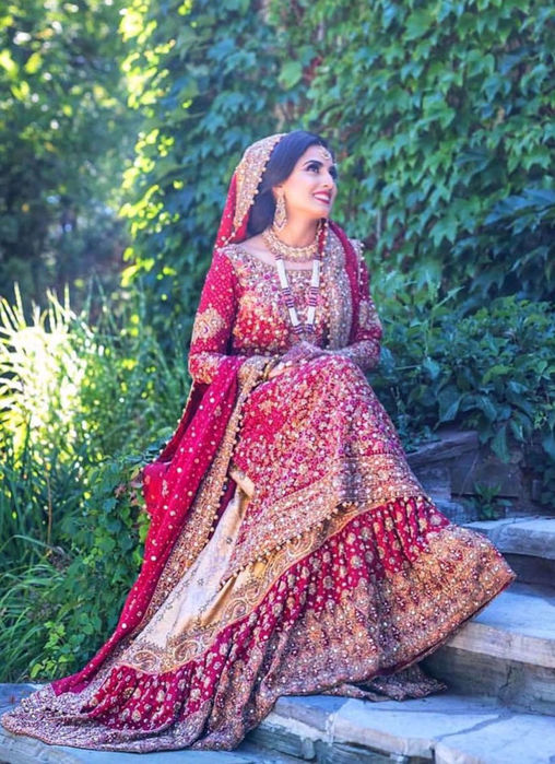 Picture of Farah Talib Aziz Gives Us A Masterclass On How To Carry The Iconic Red Bridal. Featured Here Is A Traditional Scarlett Red Ensemble With Gold Embellishments